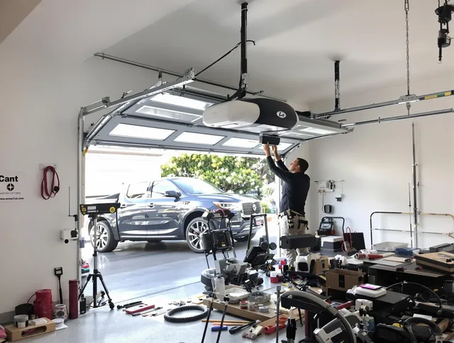 Worthington Garage Door Repair specialist installing smart garage door opener system in Worthington home