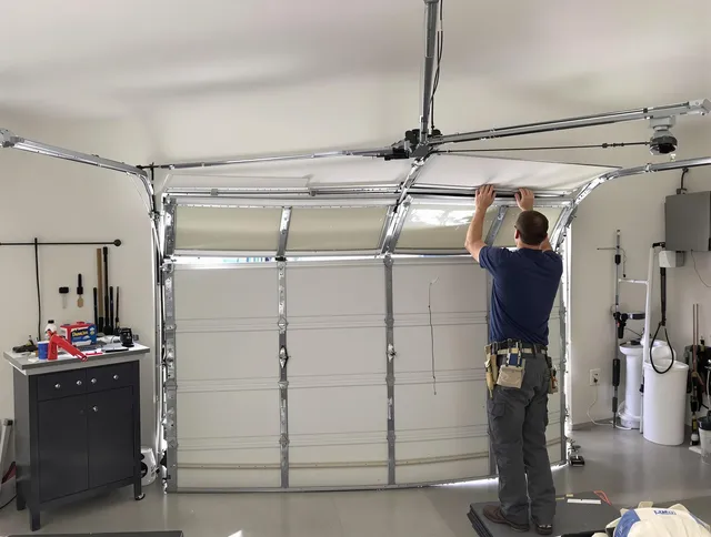 Worthington Garage Door Repair specialist performing precise section replacement on Worthington garage door
